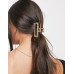 Hair clip in hammered open square in gold tone